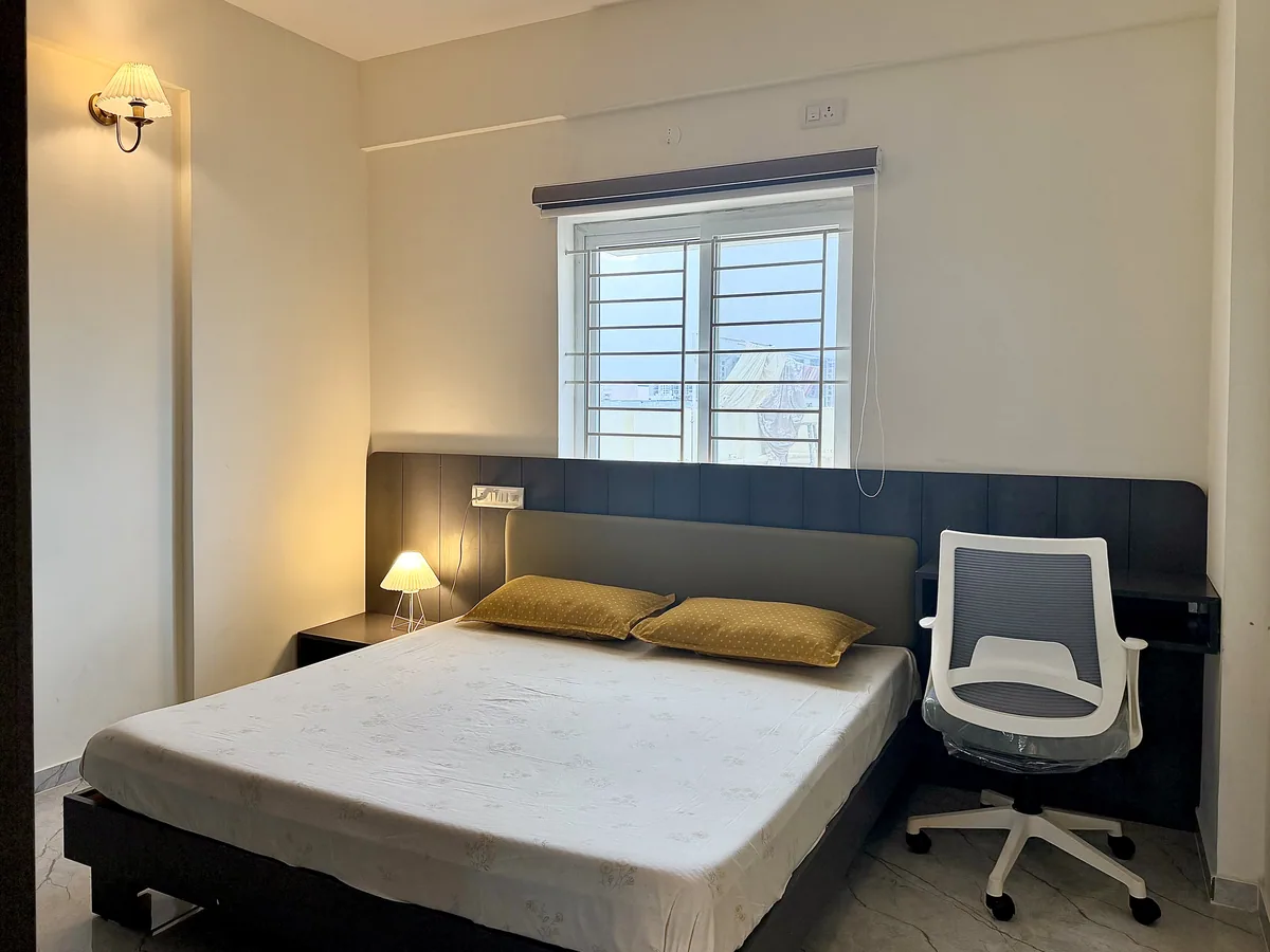 Bedroom with workspace at HomeSlice Meraki – Boutique Apartment in Whitefield